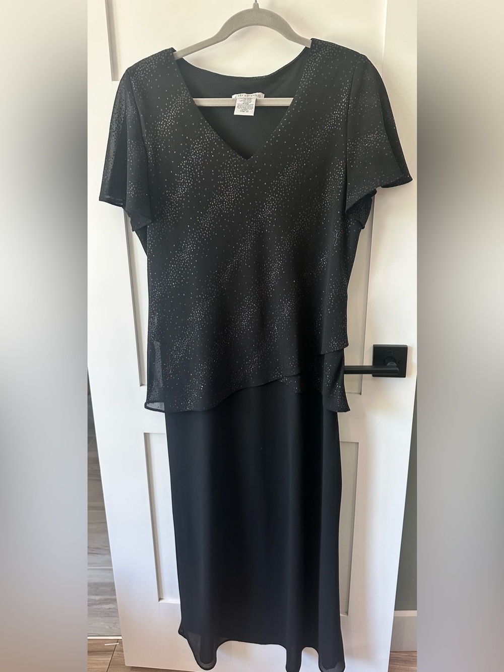 Vintage black Citi Dress with a shimmering peplum top and a plain skirt. Size 14